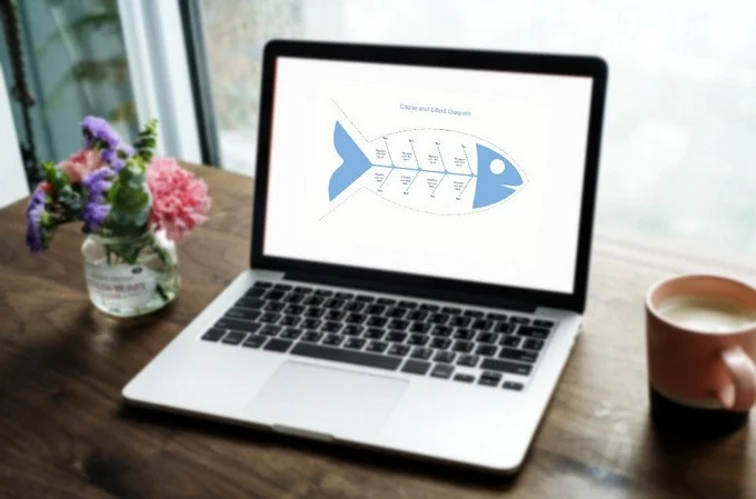 Un ordinateur portable affiche un diagramme d'Ishikawa, également appelé diagramme en arête de poisson. Ce type de diagramme est utilisé pour analyser les causes et les effets d'un problème spécifique, permettant de structurer la recherche de solutions efficaces. 