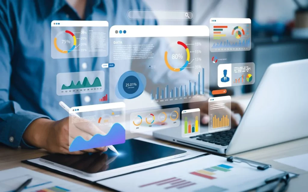 Une personne utilise des outils digitaux pour analyser des données financières et appliquer la méthode FIFO, avec divers graphiques et indicateurs affichés sur l'écran.